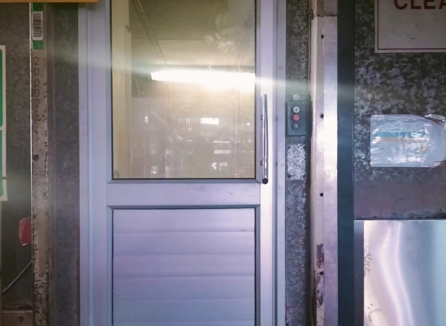 Aluminium door detail — hinges and threshold